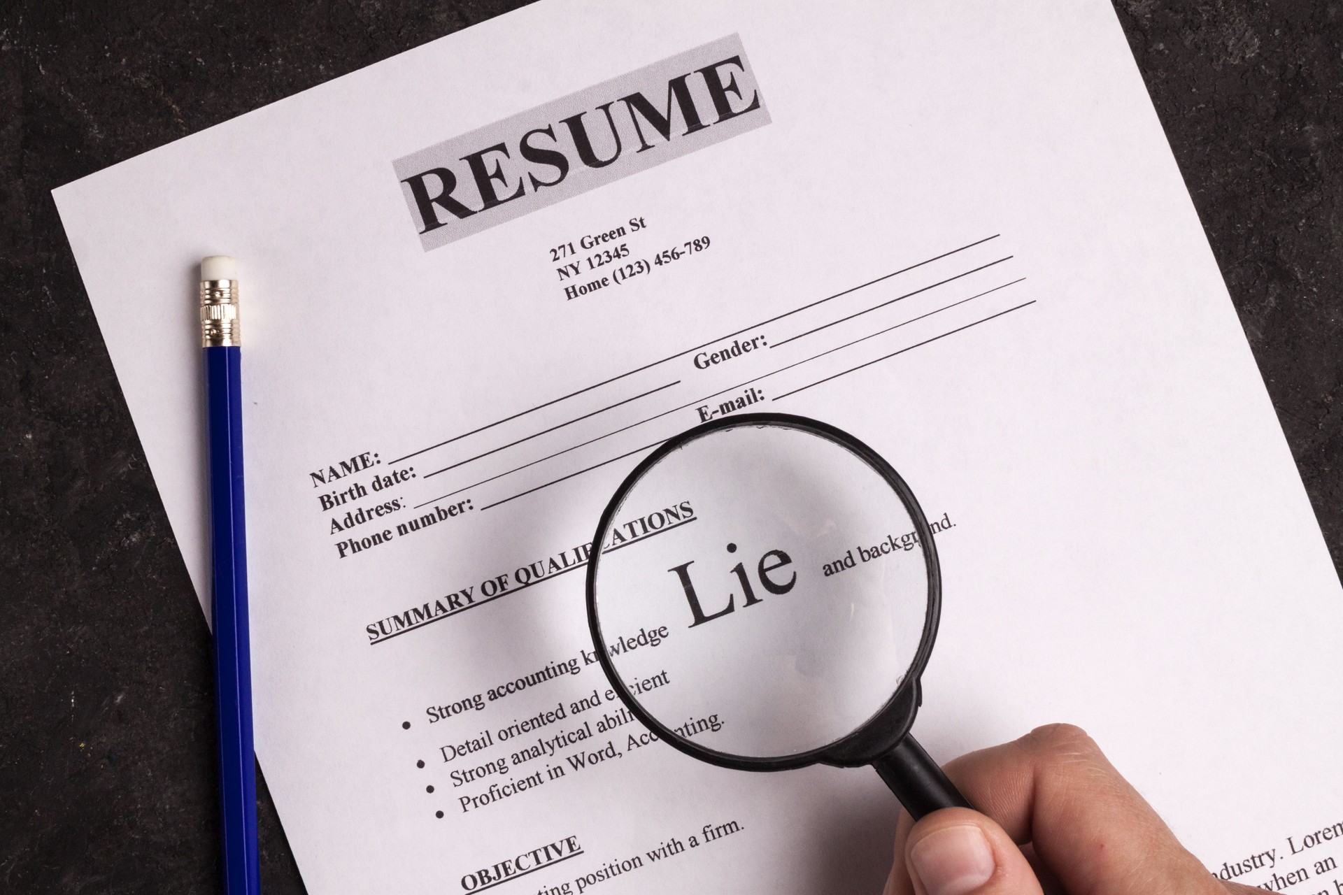 Summary close-up. The concept of false information about yourself when applying for a job, when writing a resume. Lies and deceit concept